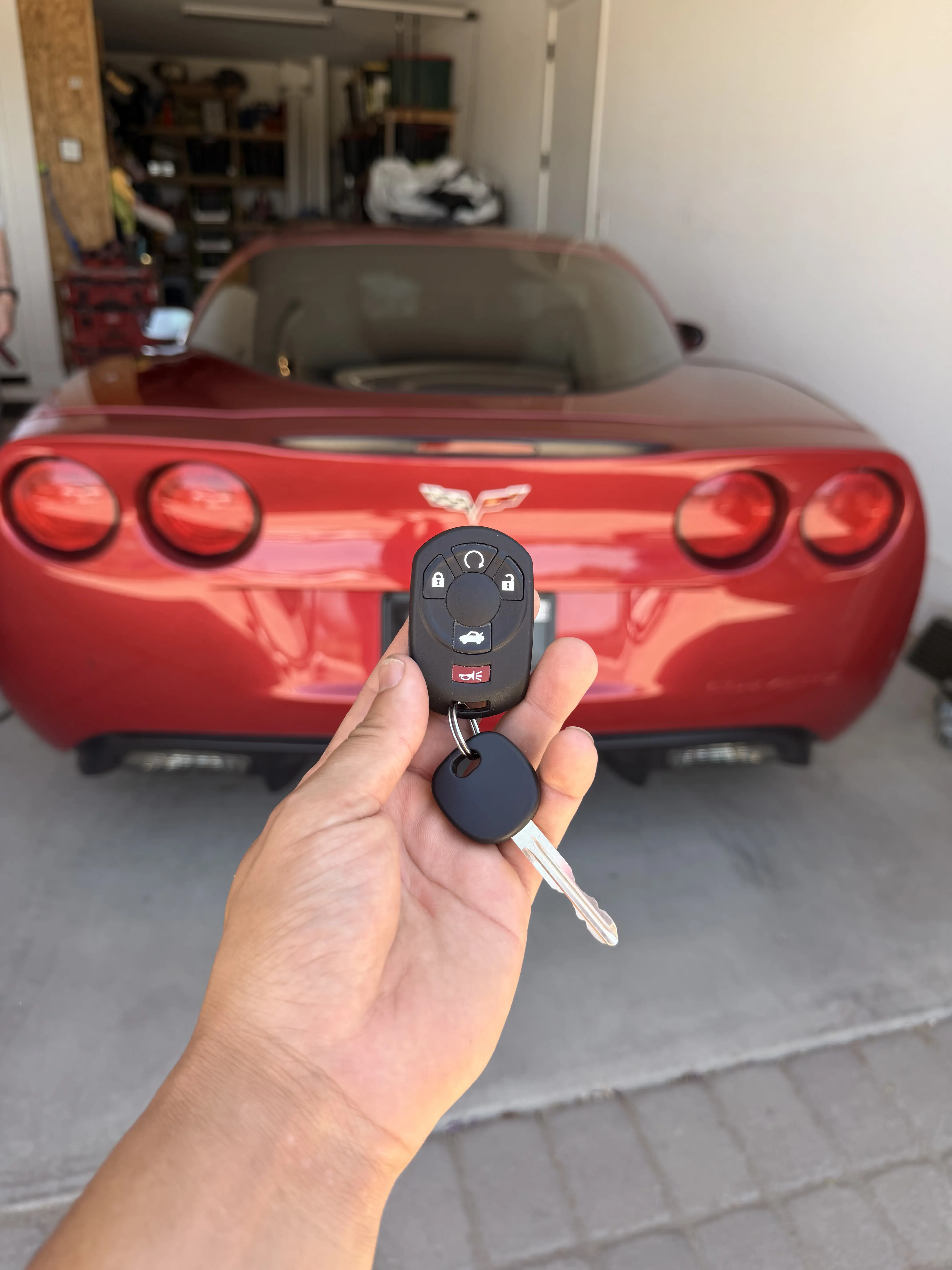 Heatwave Locksmith programming a car key in a Phoenix parking lot