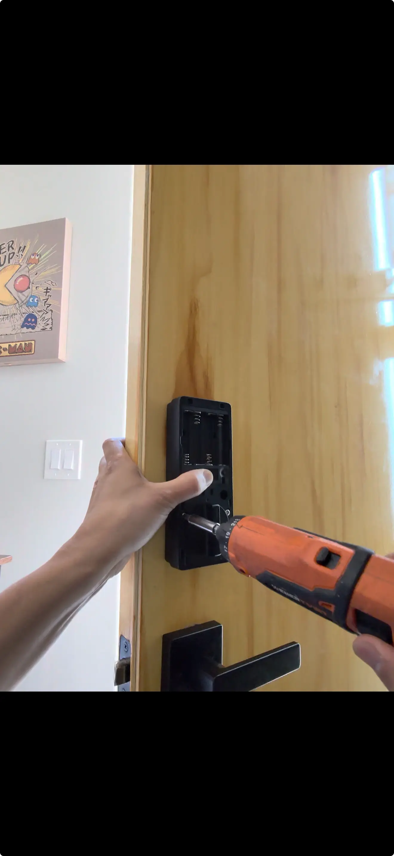 Heatwave Locksmith technician working on a home front door lock in Phoenix